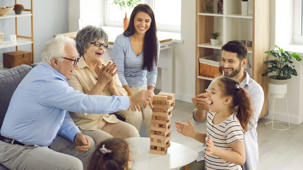 Grandparents playing a game with their grandchildren.